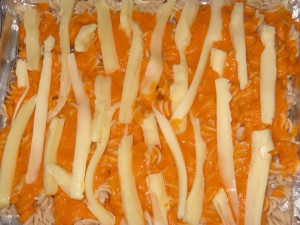 Adding the strips of cheese...